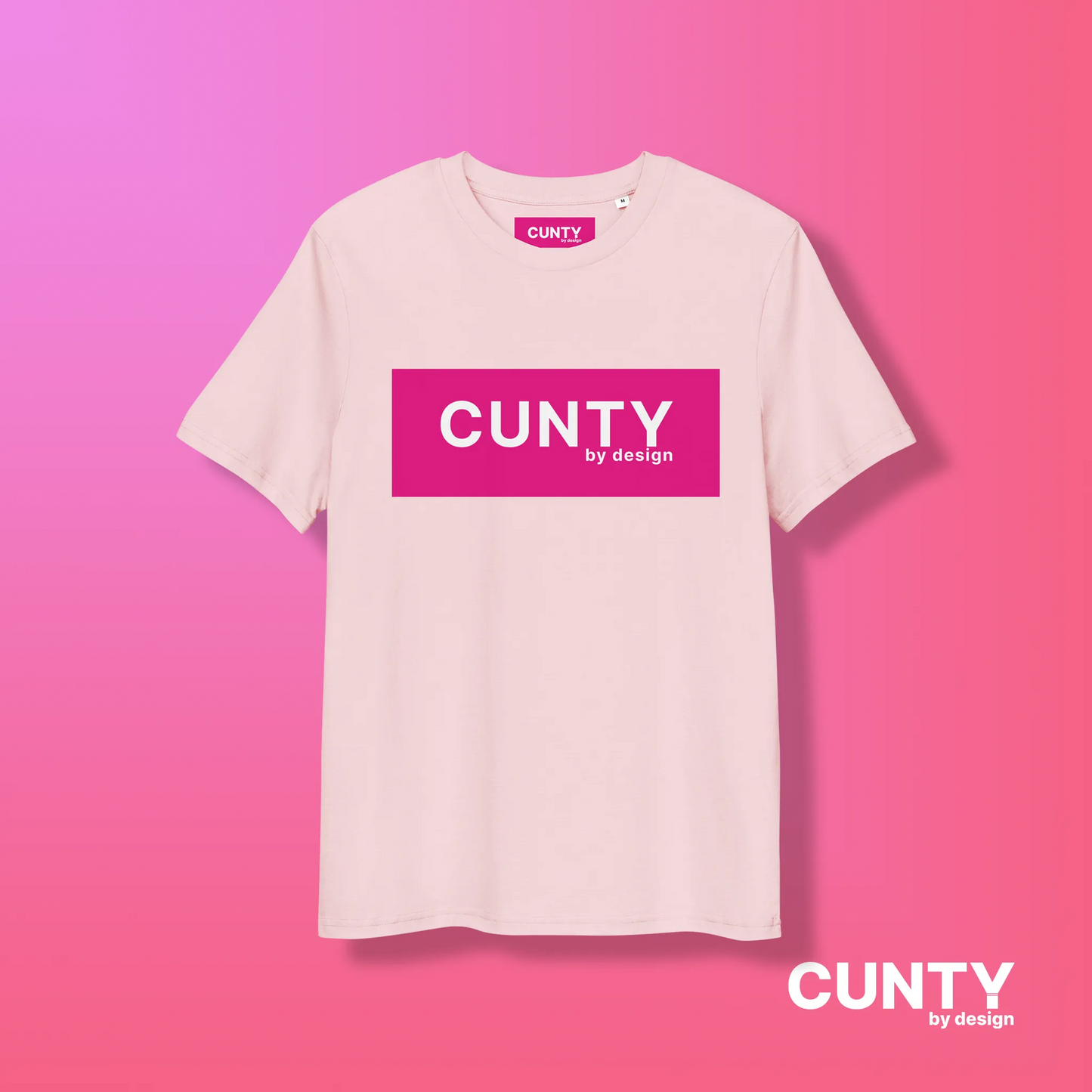 Pink with Fuchsia Design: A pastel pink unisex t-shirt displaying the bold "Cunty by Design" logo in a vibrant fuchsia rectangle, presented on a pink gradient background.