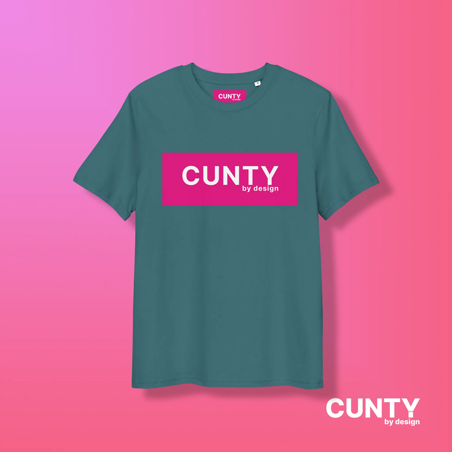 Stargazer with Fuchsia Design: A teal unisex t-shirt showcasing the "Cunty by Design" logo in a bold fuchsia rectangle, styled on a pink gradient background.