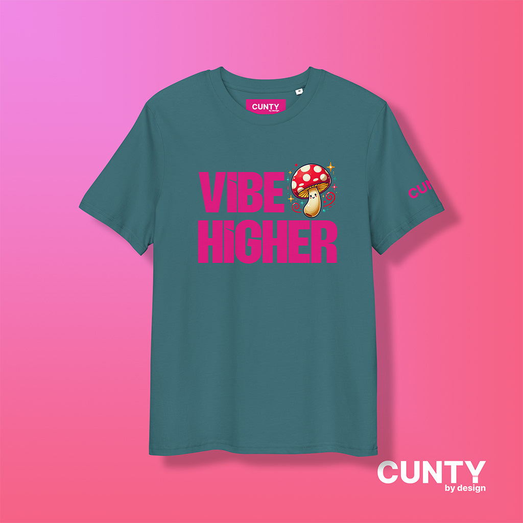 stargazer colored organic cotton t-shirt featuring the bold text "Vibe Higher" in vibrant pink, paired with a colorful magic mushroom graphic. The shirt has a unisex design with a Cunty by Design logo on the sleeve, and inside neck label displayed against a fuchsia background.