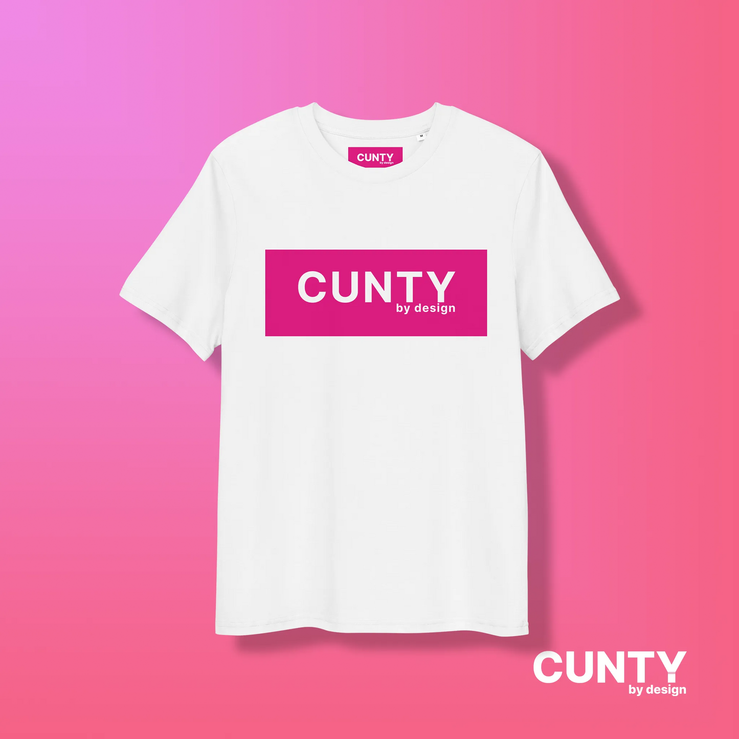 White with Fuchsia Design: A crisp white unisex t-shirt featuring the "Cunty by Design" logo in a striking fuchsia rectangle, displayed on a pink gradient background.